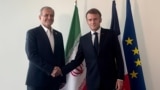 French President Emmanuel Macron (right) meets Iranian counterpart Masud Pezeshkian in New York on September 24.