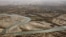An aerial view shows the Helmand River in Afghanistan's Helmand Province. According to a 1973 agreement, Afghanistan is obligated to provide Iran with 850 million cubic meters of water annually from the Helmand River. 