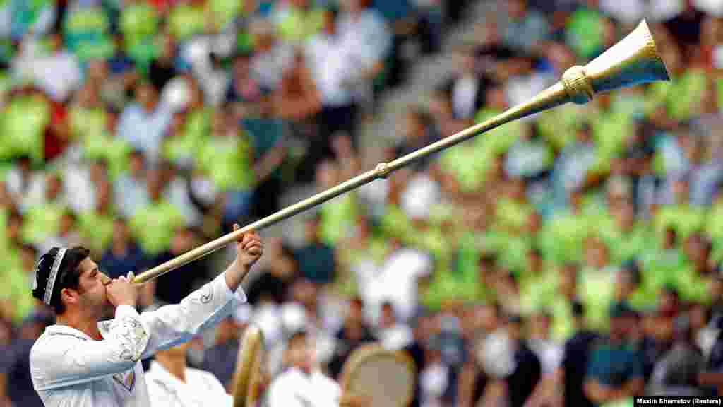 An Uzbekistan soccer fan sounds a traditional trumpet during a World Cup qualifying match in Tashkent in June 2025.Uzbekistan fans will descend on Mexico City Stadium on June 17 to watch their team become the first Central Asian country to play at the FIFA World Cup. The team's opening match against Colombia marks the pinnacle, thus far, of Uzbekistan’s century-long love affair with football.