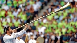 An Uzbekistan soccer fan sounds a traditional trumpet during a World Cup qualifying match in Tashkent in June 2025.<br><br>Uzbekistan fans will descend on Mexico City Stadium on June 17 to watch their team become the first Central Asian country to play at the FIFA World Cup. The team's opening match against Colombia marks the pinnacle, thus far, of Uzbekistan’s century-long love affair with football.