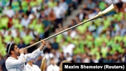 An Uzbekistan soccer fan sounds a traditional trumpet during a World Cup qualifying match in Tashkent in June 2025.<br><br>Uzbekistan fans will descend on Mexico City Stadium on June 17 to watch their team become the first Central Asian country to play at the FIFA World Cup. The team's opening match against Colombia marks the pinnacle, thus far, of Uzbekistan’s century-long love affair with football.