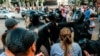 Riot police spray tear gas in the faces of protesters in Brest at a peaceful protest against the government on September 20, 2020.