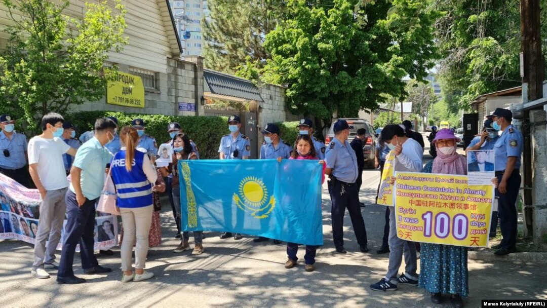 Protesters demand the return of their relatives from China outside the consulate in Almaty on May 18. 