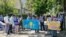 Protesters demand the return of their relatives from China outside the consulate in Almaty on May 18. 