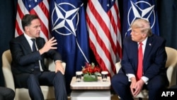 US President Donald Trump (right) speaks with NATO Secretary-General Mark Rutte at a bilateral meeting on the sidelines of the World Economic Forum in Davos, Switzerland, on January 21.