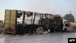 A destroyed aid truck is seen on the side of the road in the town of Orum al-Kubra on the western outskirts of the northern Syrian city of Aleppo on September 20.