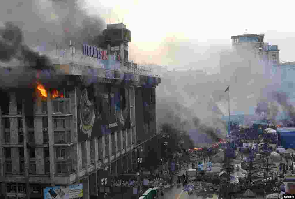 Flames rise from a trade union building on Independence Square on February 19.