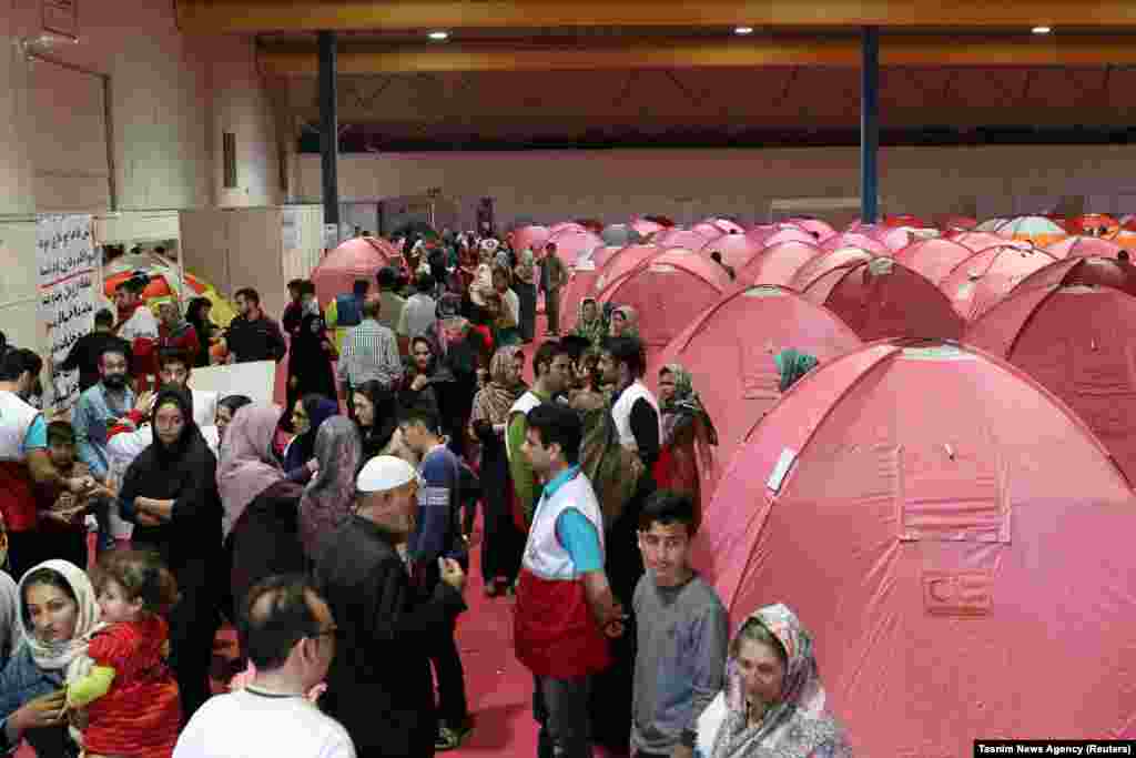 People take shelter at a stadium in Golestan Province on March 24.