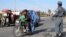 Afghan security officials check people at a road side as part of increased security measures in Helmand Province following the death of Islamic State recruiter Mullah Abdul Rauf in a military operation on February 9. 