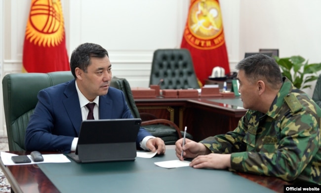 Kyrgyz President Sadyr Japarov (left) with Kamchybek Tashiev, the head of the State Committee for National Security.