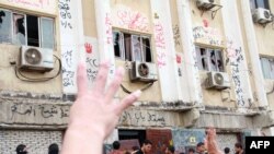 Egypt -- Students of al-Azhar University block the access to an administration building during an anti-army protest at the university in Cairo, October 30, 2013