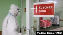 A Russian healthcare worker wearing protective gear enters the red zone at Moscow City Clinical Hospital No 15 (Filatov Hospital), which is treating patients who suffer from COVID-19.