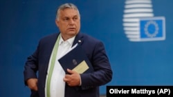 Hungarian Prime Minister Viktor Orban leaves at the end of an EU summit at the European Council building in Brussels on June 25.