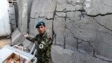 FILE: An Afghan soldier Essa Khan Laghmani explains how he shot and killed six Taliban inside the Afghan Parliament in Kabul, June 24, 2015.