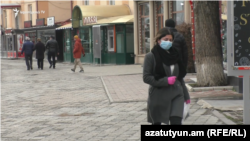 A woman wearing a face mask in Gyumri, Armenia, March 17, 2020