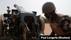 A Malian soldier is pictured during a training session on a D-30 howitzer with the European Union Training Mission (EUTM) in Mali on March 23.