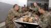 Armenia - Defense Minister Seyran Ohanian (L) dines with soldiers at a military base in Tavush province, 20Aug2013.