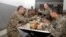Armenia - Defense Minister Seyran Ohanian (L) dines with soldiers at a military base in Tavush province, 20Aug2013.