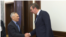 Serbian President Aleksandar Vucic (right) met with Russian Ambassador to Belgrade Aleksandr Bocan Harchenko before the security meeting on November 21. 