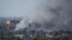 Smoke rises above a residential area after recent shelling near Donetsk airport during fighting between pro-Russian separatists and Ukrainian government forces. 