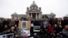 Serbia -- Photojournalists pose for a photo with their pictures and cameras during a protest in front of the parliament building in Belgrade, January 26, 2016