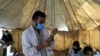 A doctor fills a syringe with the Johnson & Johnson COVID-19 vaccine at a vaccination center in Kabul on July 11, 2021. The COVID-19 vaccines were donated by the United States and delivered through the UN.