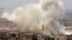 Smoke plumes follow reported air strikes on the town of Khan Sheikhun in the southern countryside of the rebel-held Idlib Province on June 3.