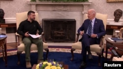 U.S. President Joe Biden (right) meets with Ukrainian President Volodymyr Zelenskiy in the White House in Washington on September 26.