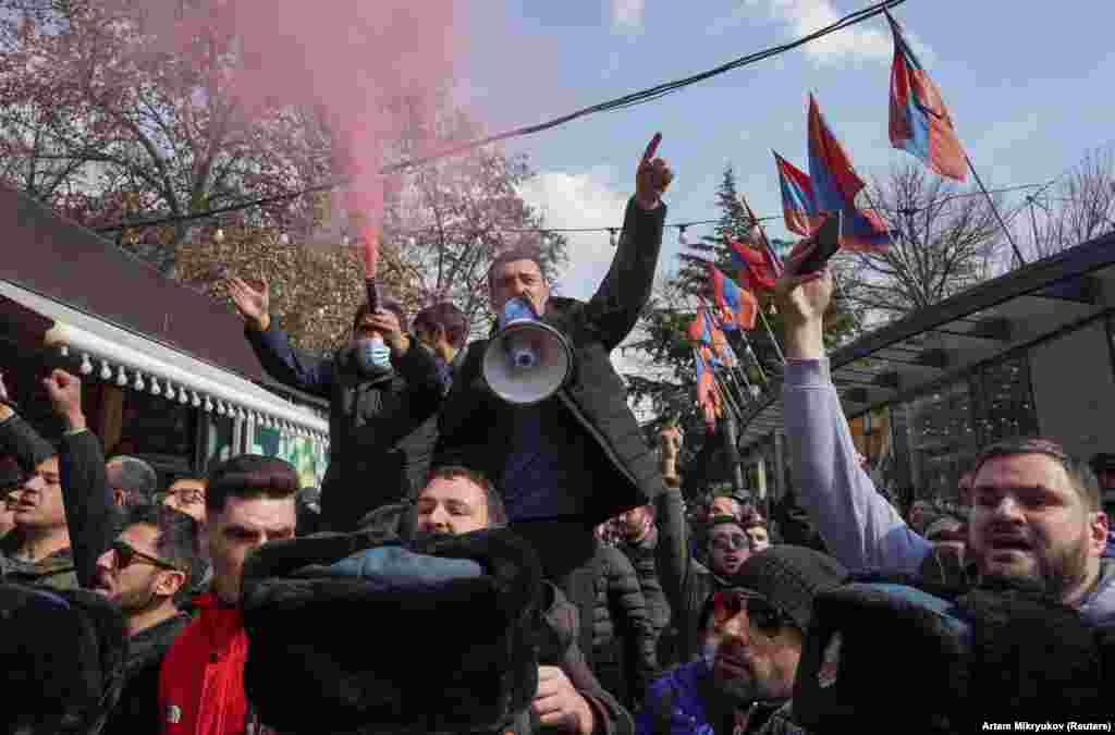 Protesters opposed to Pashinian shout slogans in central Yerevan. A February 25 letter signed by Armenian military leaders called for the prime minister&#39;s resignation. The letter came a day after Pashinian fired a top military official.&nbsp;&nbsp;