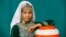 PAKISTAN -- A Hazara girl poses for a photograph during a practice ahead of the Hazara Culture Day, June 21, 2019