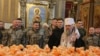 A priest blesses 7,000 Easter cakes for Ukrainian soldiers at St. Michael's Cathedral in Kyiv on April 9. 