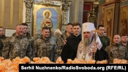 A priest blesses 7,000 Easter cakes for Ukrainian soldiers at St. Michael's Cathedral in Kyiv on April 9. 