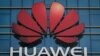 The Huawei logo stands on a Huawei office building in Dongguan in China’s southern Guangdong province, December 18, 2018
