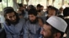 Taliban prisoners await their release from Bagram Prison, north of Kabul, on May 26.