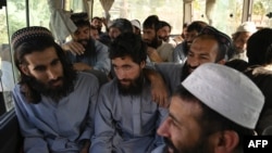 Taliban prisoners await their release from Bagram Prison, north of Kabul, on May 26.