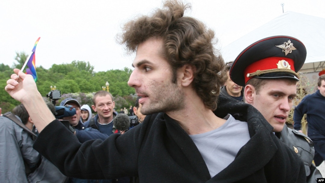 A Russian police officer arrests a participant in the gay rights protest in Moscow.