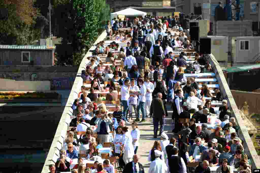 SEPTEMBER 23, 2012 -- More than 2,000 people have a traditional breakfast on a 15th-century stone bridge in Skopje, Macedonia, to celebrate the Christian Orthodox holiday &ldquo;Holy Mother of God,&quot; who is also the patron saint of the city.