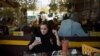 Iran -- An Iranian woman uses her mobile phone to follow election news in a coffee shop in Tehran, Iran May 17, 2017. 