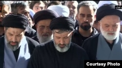 The sons of late Iranian Supreme Leader Ali Khamenei, Meysam (left), Masud (center), and Mostafa) attend funeral prayers for their father on July 5.