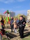 Mourners Leave Flowers, Toys For Victims Of Russian Strike In Kryviy Rih Mourners Leave Flowers, Toys For Victims Of Russian Strike In Kryviy Rih