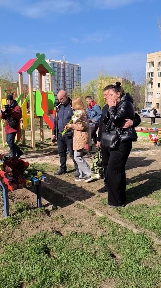 Mourners Leave Flowers, Toys For Victims Of Russian Strike In Kryviy Rih