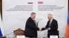 Armenia - Deputy Prime Minister Mher Grigorian (right) and his Russian counterpart Alexei Overchuk sign documents after chairing a meeting in Yerevan, December 17, 2025.