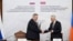Armenia - Deputy Prime Minister Mher Grigorian (right) and his Russian counterpart Alexei Overchuk sign documents after chairing a meeting in Yerevan, December 17, 2025.