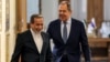 Iranian Foreign Minister Abbas Araghchi (left) and his Russia counterpart, Sergei Lavrov, walk together after meeting in Tehran in February. 