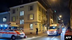 Ambulances and police cars are seen outside a Muslim prayer hall in central Zurich on December 19 after three people were injured by gunfire.