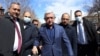Former Armenian President Serzh Sarkisian (in the center) surrounded by supporters outside a courthouse in Yerevan, March 18, 2021