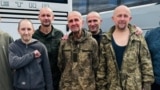Former Kherson Mayor Volodymyr Mykolayenko (center) with other Ukrainian prisoners of war after his release from Russian captivity on August 24. 