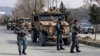 Foreign security personnel and Afghan police arrive at the site of the attack in Kabul on March 6.