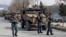 Foreign security personnel and Afghan police arrive at the site of the attack in Kabul on March 6.