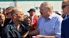 Belarusian President Alyaksandr Lukashenka (right) argues with a MZKT worker at the plant in Minsk on August 17.